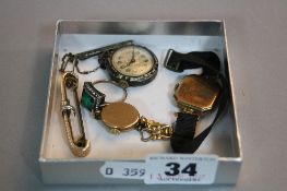 A TRAY OF TWO GOLD WATCH HEADS, one silver watch, 9ct and silver dress ring and a brooch