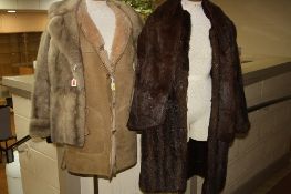 A BROWN LONG FUR COAT, a short light fur jacket, a fur stole and a sheepskin jacket, size 14 (4)