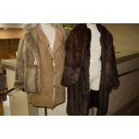 A BROWN LONG FUR COAT, a short light fur jacket, a fur stole and a sheepskin jacket, size 14 (4)