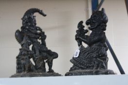 A PAIR OF CAST 'PUNCH' AND 'JUDY' DOOR STOPS (2)