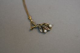 A 9CT PEARL GEM SET FLOWER PENDANT AND CHAIN, approximate weight 3.3 grams