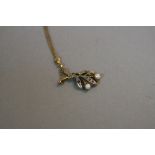 A 9CT PEARL GEM SET FLOWER PENDANT AND CHAIN, approximate weight 3.3 grams