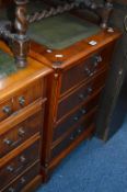 A YEWWOOD TWO DRAWER FILING CABINET with green tooled leather inlay top (key)