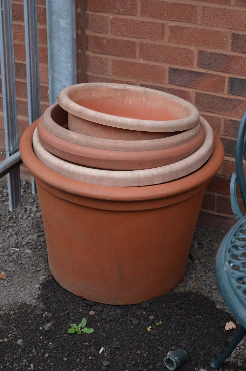 FIVE PLASTIC PLANTERS