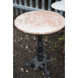 A PAINTED CAST IRON CIRCULAR PATIO TABLE, with seperate top