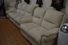 A BEIGE UPHOLSTERED FOUR PIECE BEIGE SUITE, comprising of a three and a two seater and a pair of