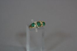 A 9CT EMERALD AND DIAMOND RING, ring size K, approximate weight 2.6 grams
