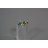 A 9CT EMERALD AND DIAMOND RING, ring size K, approximate weight 2.6 grams