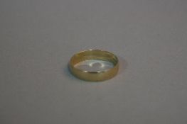 A 9CT GOLD BAND, ring size U, approximate weight 2.3 grams