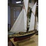 A MODEL OF A SAILING SCHOONER, of wooden construction, in need of minor restoration, length