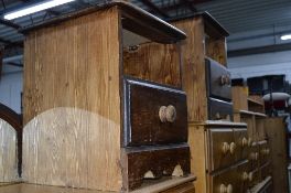 A PAIR OF STAINED PINE BEDSIDE UNITS (sd)