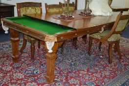 A RILEY SLATE BED SNOOKER TABLE, the top cover splits into five sections, on carved square supports,