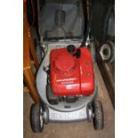 A HONDA HR1950 PETROL SELF PROPELLED LAWNMOWER, with grass box (s.d, unsure of working order)