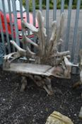 A TEAK ROOT TWO SEATER GARDEN BENCH, approximate size width 129cm x height 143cm
