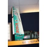A BOSCH BATTERY HEDGE TRIMMER and a Black and Decker electric chainsaw (2)
