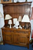 AN OAK LINENFOLD DRESSER, with two small drawers