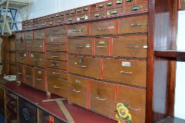 A LARGE 20TH CENTURY OAK HABERDASHERY/SHOP FITTING, made up in two sections, the top section is made