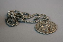 A SILVER ST SHRISTOPHER PENDANT, on a silver chain, approximate weight 67 grams