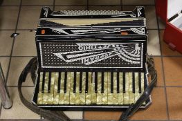 A SOPRANI SETTIMIO RIALTO PIANO ACCORDIAN, in black and cream with crystal inserts, one key is