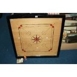 A GAME OF 'CARROM'