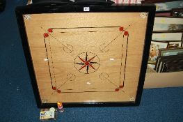 A GAME OF 'CARROM'