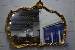 A GILT FRAMED OVERMANTLE MIRROR, with foliate detail