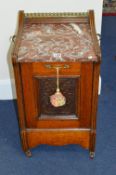 A CARVED OAK PURDONIUM, with red veined marble top and brass handles (key)