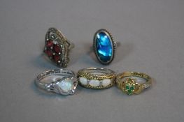 FIVE MIXED SILVER RINGS, approximate weight 23.8 grams