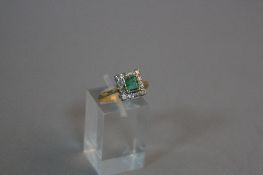 A MID TO LATE 20TH CENTURY EMERALD AND DIAMOND SQUARE SHAPED CLUSTER RING, estimated total eight cut