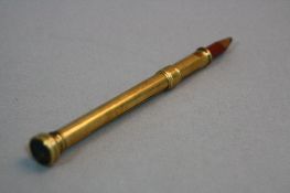 A 9CT SOLID PENCIL WITH A HARDSTONE INTAGLIO