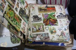 A VICTORIAN SCRAP BOOK, containing glued chromo litho scraps and magazine cut outs of animals,
