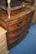 A GEORGIAN WALNUT BOWFRONT CHEST, of two short and three long drawers (in need of restoration)