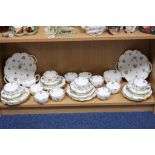 GEORGE JONES CRESCENT CHINA TEAWARES, florally decorated on white background with gilt trim, to