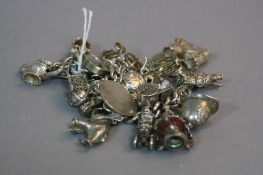 A SILVER CHARM BRACELET, approximate weight 102 grams