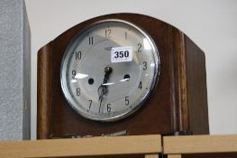 A SMITHS ENFIELD MANTEL CLOCK, (key and pendulum)