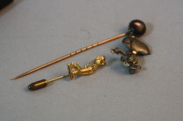 A 9CT GOLF TIE PIN, a 9ct moonstone tie pin and a silver Snoopy brooch (3)
