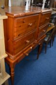 A PINE HALL TABLE, with two drawers and a pair of pine two drawer bedside cabinets (3)