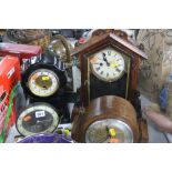 A SMITHS ELECTRIC BAKELITE CLOCK, a ceramic mantel clock (no key or pendulum), two other clocks (one