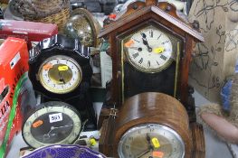 A SMITHS ELECTRIC BAKELITE CLOCK, a ceramic mantel clock (no key or pendulum), two other clocks (one