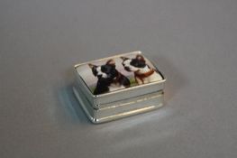 A SILVER ENAMELED BOX OF TWO BULL DOG TYPE DOGS
