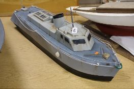 A POWERED NAVAL PATROL BOAT, of metal construction, in need of minor restoration, length
