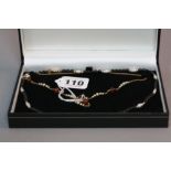 A 14CT BEADED NECKLACE together with a 9ct necklace
