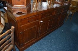 A HEAVY HARDWOOD SIDEBOARD, with four drawers, approximate size width 200cm x height 95cm x depth