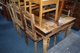 A LARGE HARDWOOD DINING TABLE, approximate size width 176cm x depth 90cm x height 77cm and six