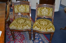 SIX VICTORIAN MAHOGANY DINING CHAIRS, with swept backs, green upholstery on turned front legs