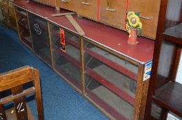 A LARGE MID 20TH CENTURY OAK HABERDASHERY/SHOP COUNTER, with formica top made up of twelve drawers/
