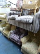 A STRIPPED UPHOLSTERED TWO SEATER SETTEE, a similar armchair