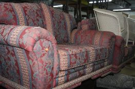 AN UPHOLSTERED THREE PIECE SUITE, comprising of two two seater settees and an armchair