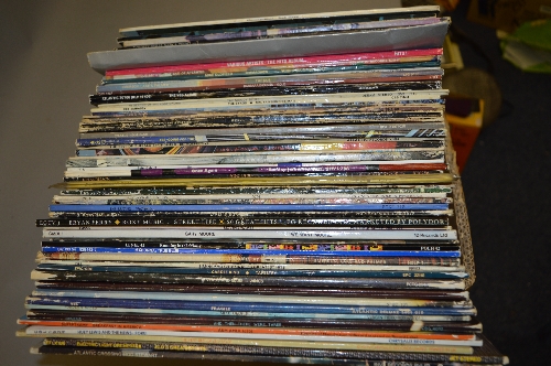 A BOX OF OVER 50 L.P'S, by artists such as Pink Floyd, The Byrds, Yes, Genesis, etc