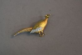 A LATE 20TH CENTURY 18CT GOLD PHEASANT BROOCH, three colour textured gold design with ruby set